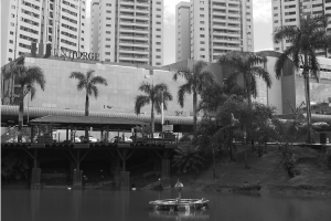 Fotografia do lago e fachada da entrada da Unijorge